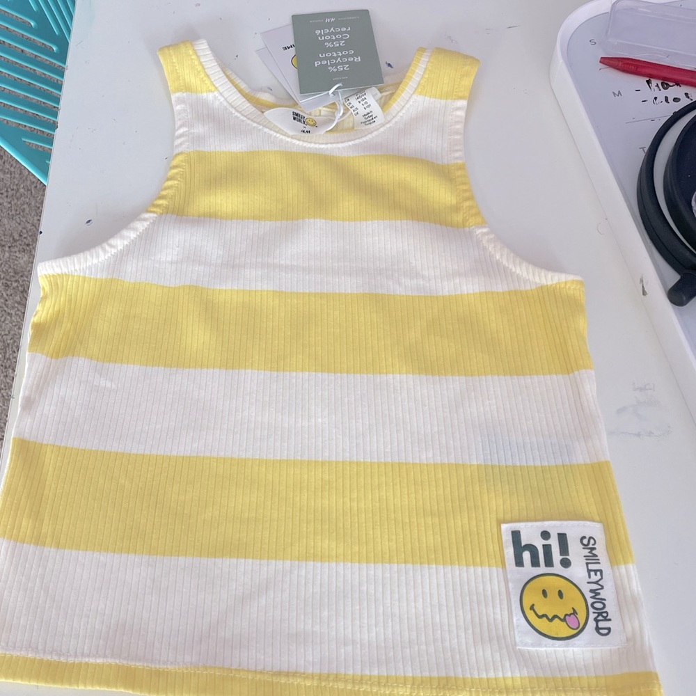 H & m cute yellow smiley face tank top with tags from a pet and smoke free house